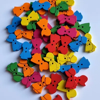 Guzik 10x20mm lalka żółty 2szt